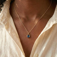 Arched Frame Blue Oval Spinner Pendant Necklace