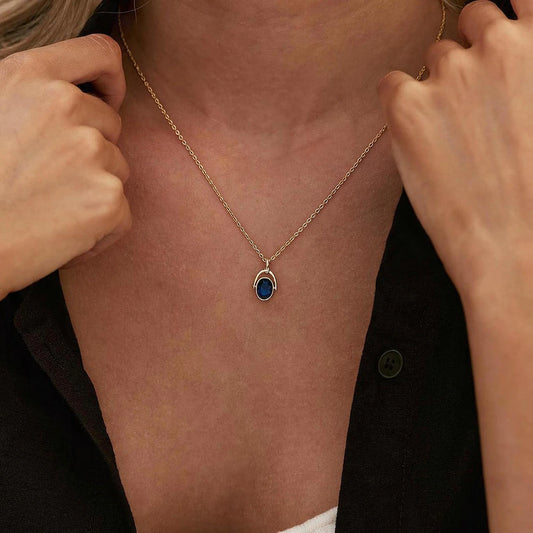Arched Frame Blue Oval Spinner Pendant Necklace