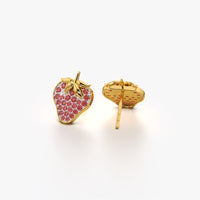Gold strawberry-shaped earrings with red gemstones on a white background