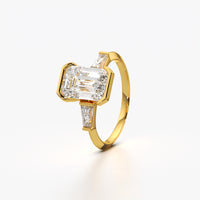 Emerald Cut Solitaire Bezel Three Stone Ring
