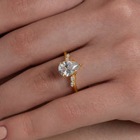 Pear Cut Solitaire Ring with Marquise Accents