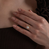 Pear Cut Solitaire Ring with Marquise Accents