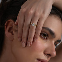 Pear Cut Solitaire Ring with Marquise Accents