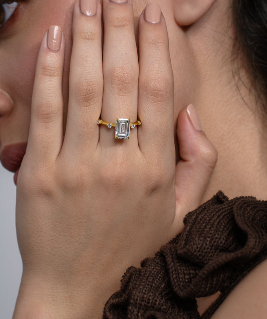 Emerald Cut Solitaire Ring with Scattered Stone Band