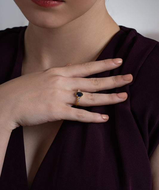 Oval Blue Diamond Ring with Graduated Moissanite Side Stones
