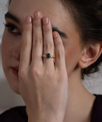 Blue Oval Centre Ring with Cluster Side Stones