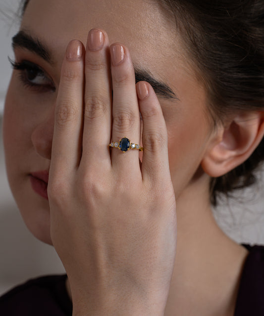 Oval Blue Diamond Ring with Graduated Moissanite Side Stones