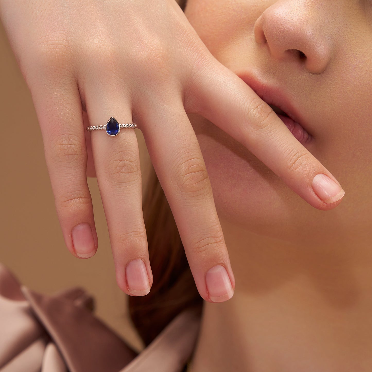 Elegant Blue Pear Solitaire Ring