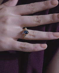 Blue Oval Centre Ring with Cluster Side Stones